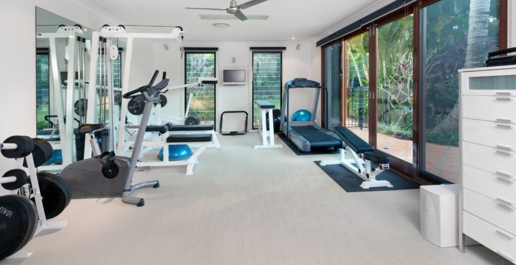 Small personal training studio interior with strength equipment, treadmill, and benches, Studio OS Basic