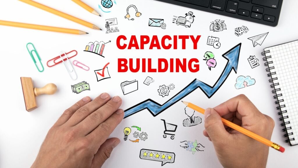 Capacity building concept with upward arrow, business icons, and handwritten planning visuals